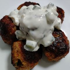 A picture of Pork meatballs with mint and tzatziki.