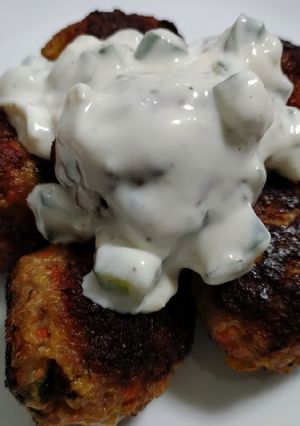 A picture of Pork meatballs with mint and tzatziki.