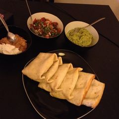 Beef Chimichangas with Pico De Gallo, Guacamole & Sour Cream A picture of Beef Chimichangas with Pico De Gallo, Guacamole & Sour Cream.