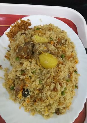 A picture of Mutton yakhni polaw potato green piece.