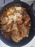 Pollo en salsa con maní