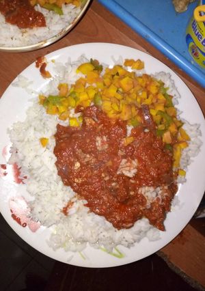 A picture of Rice with stew and carrots.