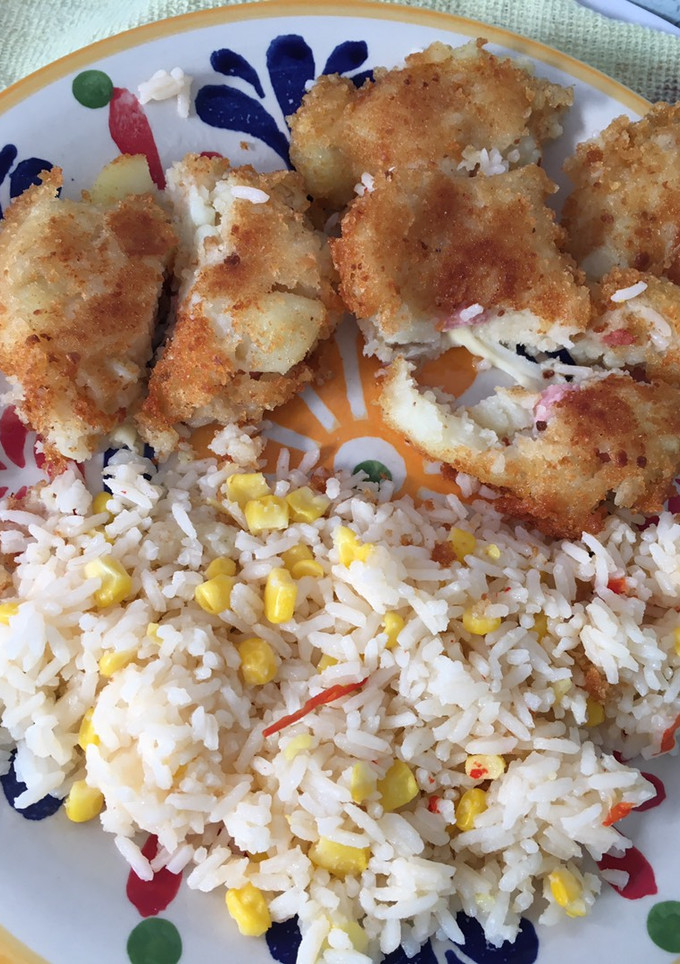 Una foto de Arroz no tan Primavera con Papas rellenas😎🌸