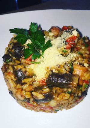 Una foto de Risotto de morcillas longanicillas y pimientos