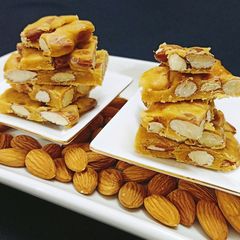 Almond Chikki Bite 😍😍 A picture of Almond Chikki Bite 😍😍.