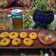 A picture of Poha Mendu vada with Orange Mojito.