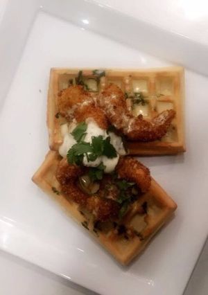 A picture of Savoury Waffle with Coconut crumbed prawns.