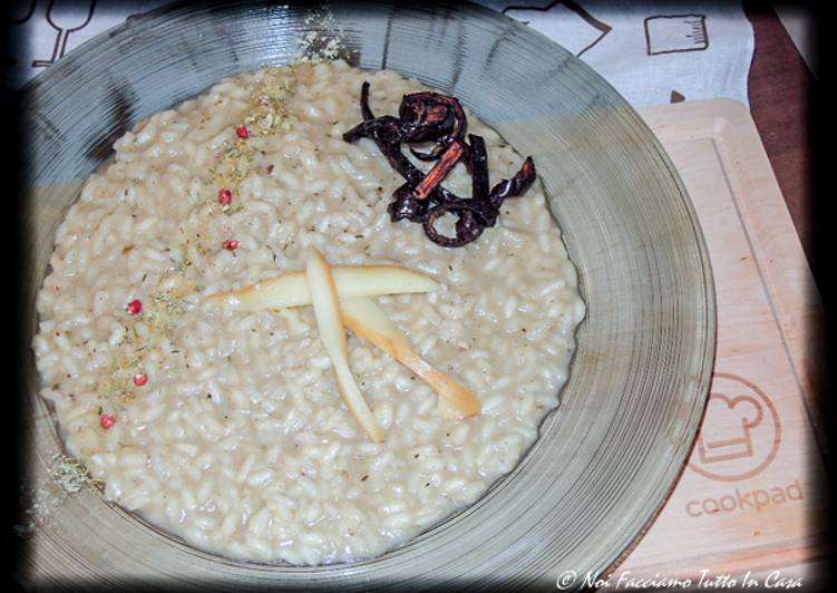 Risotto con crema di melanzana, scamorza ed erbe creole