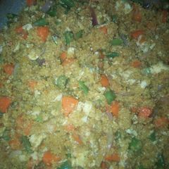 A picture of Fried couscous with veggies and proteins.