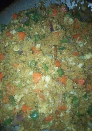 A picture of Fried couscous with veggies and proteins.