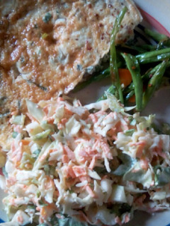 A picture of Coleslaw, omelette and veggies.