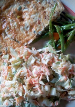 A picture of Coleslaw, omelette and veggies.