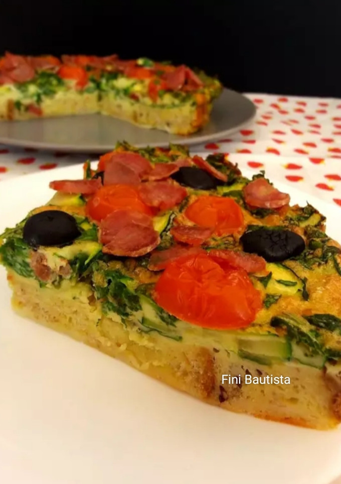 Una foto de Quiche de espinacas calabacín con base de pan