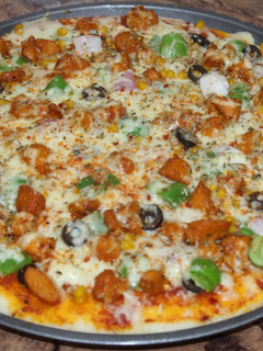 A picture of Chicken tikka pizza | homemade | by cooking world/.