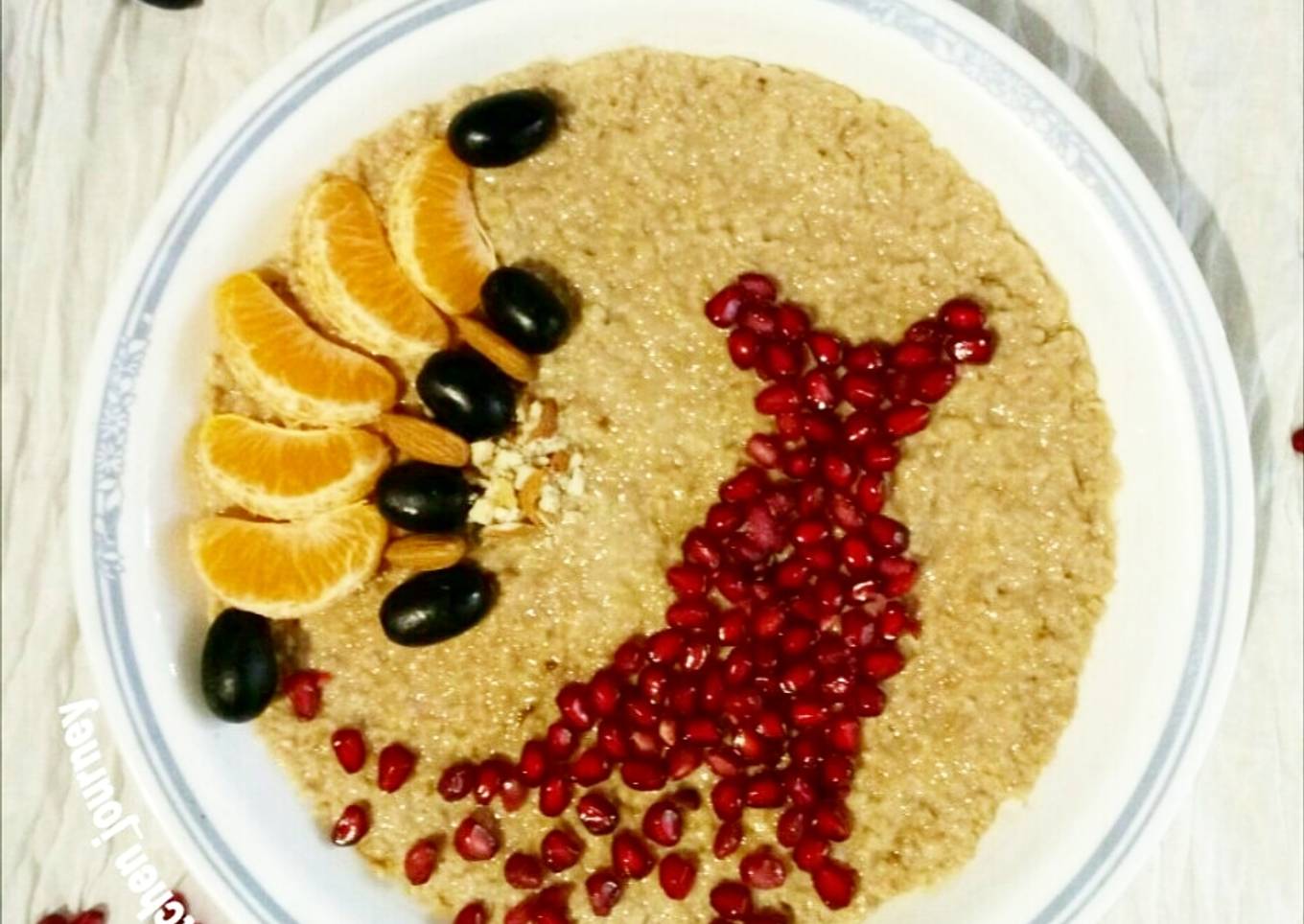 Chocolate flavoured oats with seasonal fruits and nuts