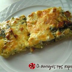 A picture of Zucchini in the oven with cheeses.