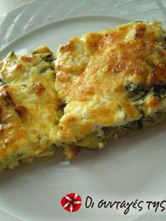 A picture of Zucchini in the oven with cheeses.