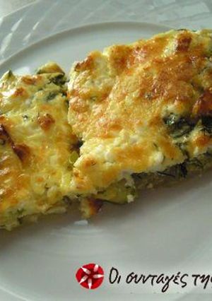 A picture of Zucchini in the oven with cheeses.