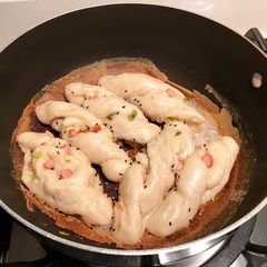 A picture of Pan-fried hotdog & spring onion rolls.