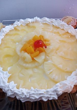 Una foto de Tarta de ananá y durazno