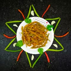 A picture of Stuffed Cluster Beans Curry.
