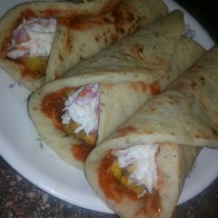 A picture of Shawarma roll with homemade shawarma bread.
