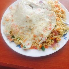 A picture of Veggie Noodles with veggie fried eggs.