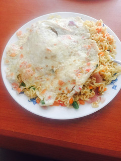 A picture of Veggie Noodles with veggie fried eggs.