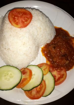 A picture of White rice With stew.
