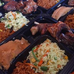 A picture of Fried rice,moi moi with fried chicken.