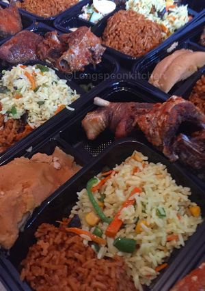 A picture of Fried rice,moi moi with fried chicken.