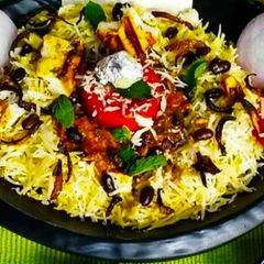 A picture of Saffron dum Biryani with Rajma curry.