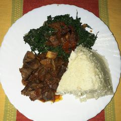 A picture of Liver fry ugali with veggies.