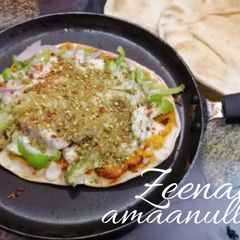 A picture of Pita Bread Thyme and Veg Pan Pizza.