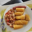 Boiled plantain with egg sauce and sausage