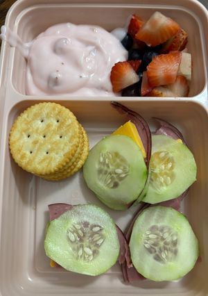 A picture of Bento box Roast Beef And Cheese Cucumber Sandwiches.
