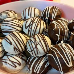 A picture of Gluten Free~ Almond and Cocoa Truffles covered in Vanilla or Milk Chocolate.