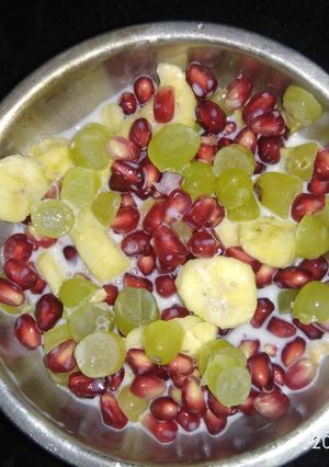 A picture of Grapes pomegranate banana custard.