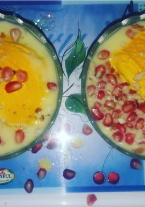 A picture of Fruit Custard with Mango Ice cream.