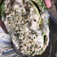 A picture of Keto Friendly Avocado with tahini and hemp seed.