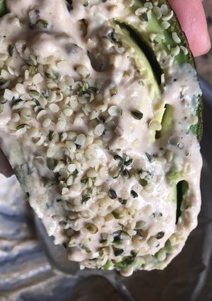 A picture of Keto Friendly Avocado with tahini and hemp seed.