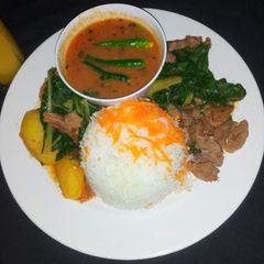 A picture of Beef stew with spinach.