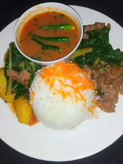 A picture of Beef stew with spinach.