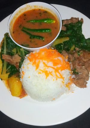 A picture of Beef stew with spinach.