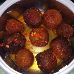 A picture of Gulab jamun(stuffed).