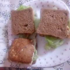 A picture of Brown bread, egg and lettuce sandwich.