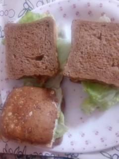 A picture of Brown bread, egg and lettuce sandwich.
