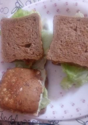 A picture of Brown bread, egg and lettuce sandwich.