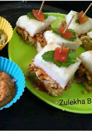 A picture of Thattey idli veggie and cheese stuffed mini sandwitches.