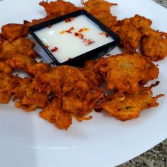 Bottle gourd fritter with yoghurt dip A picture of Bottle gourd fritter with yoghurt dip.